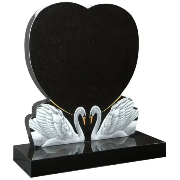 Heart shaped lawn memorial with matching swan designs on a rectangular base.