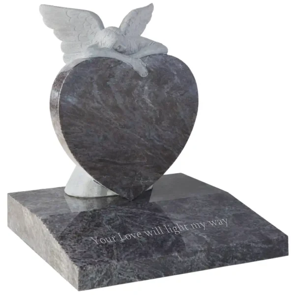 Heart shaped memorial with carved angel resting on the memorial with a desk shaped base.