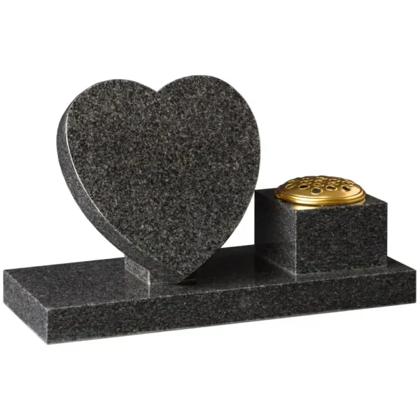 A heart shaped memorial with a rectangluar base and a memorial vase sitting to the right of the base.